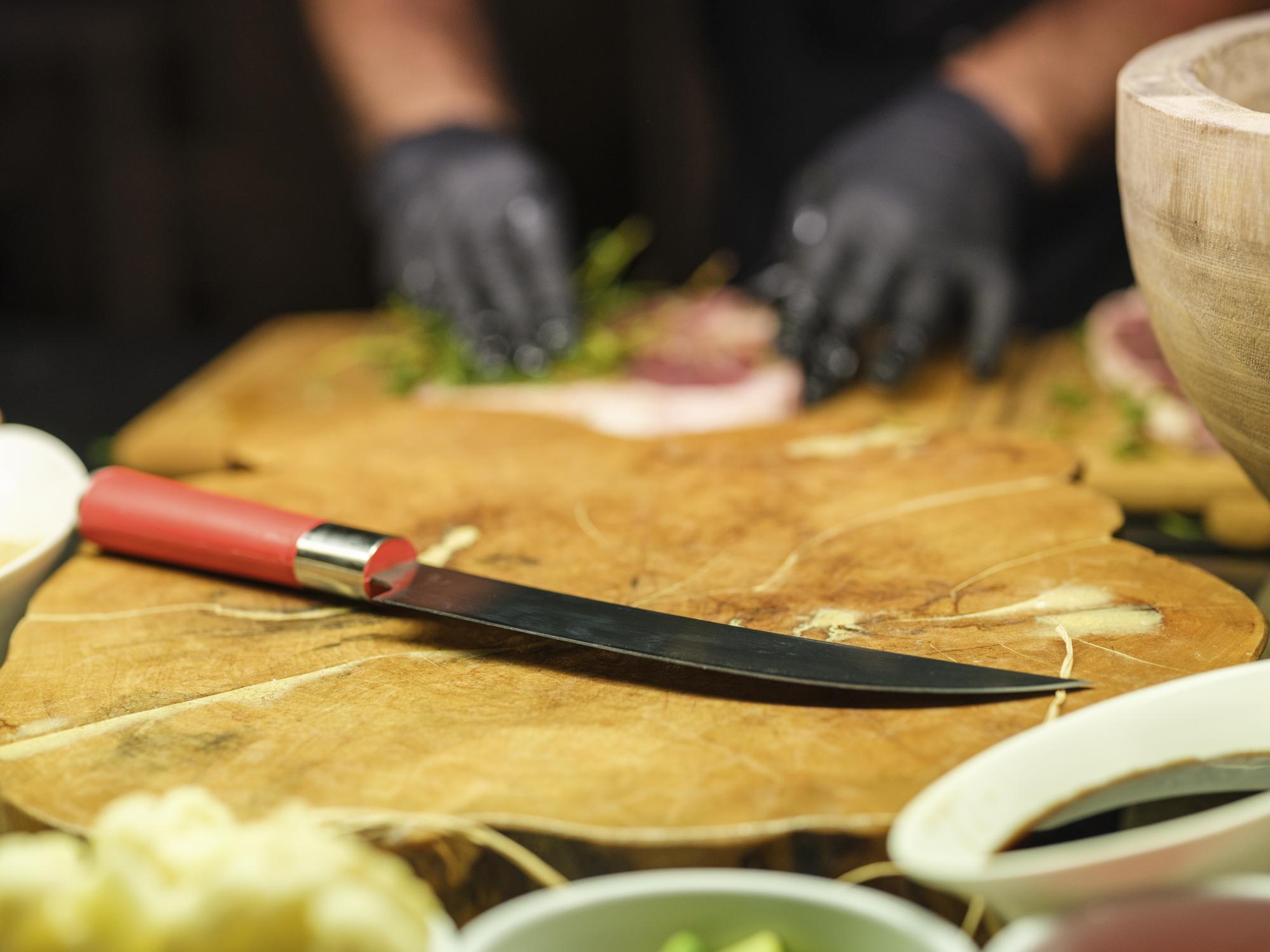 Instructor demonstrating knife technique